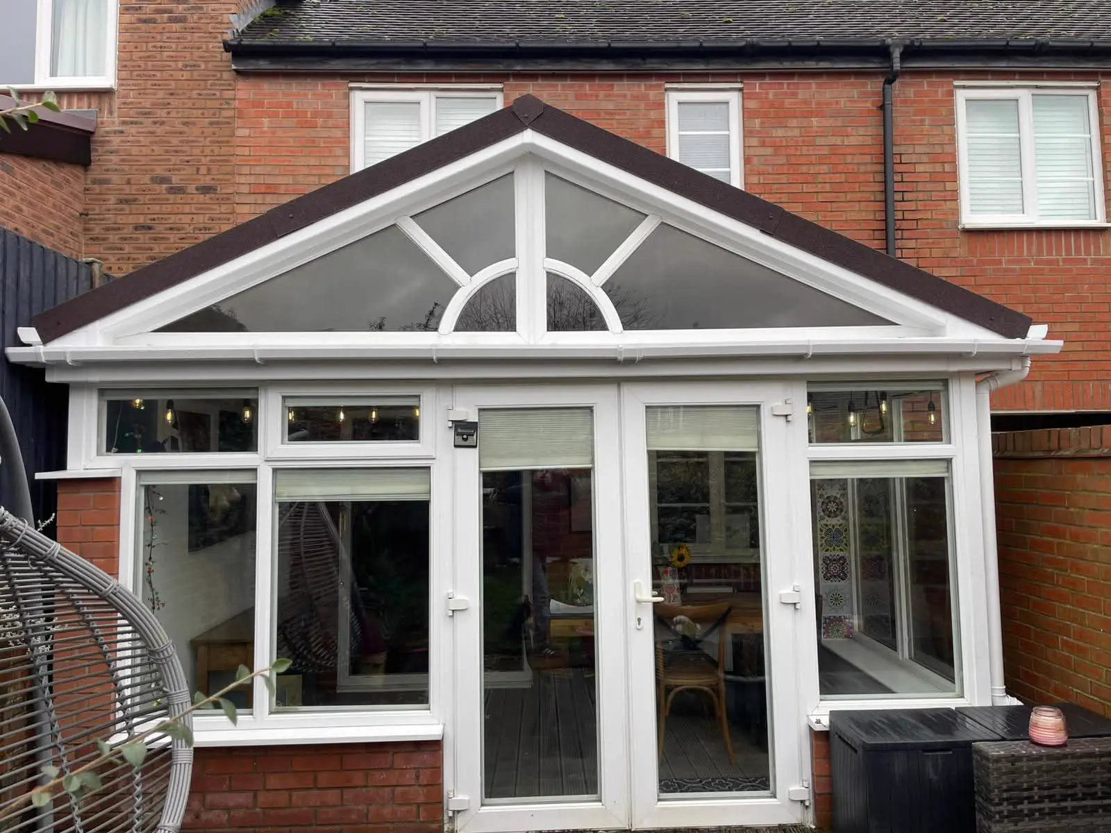 White framed conservatory completed by Shire at a brick home